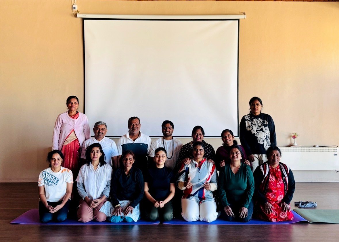 Participants gathered after a yoga and wellness workshop